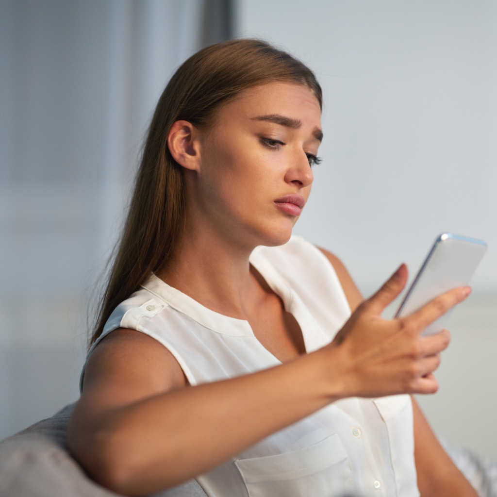 girl looking at phone for relationship codependency