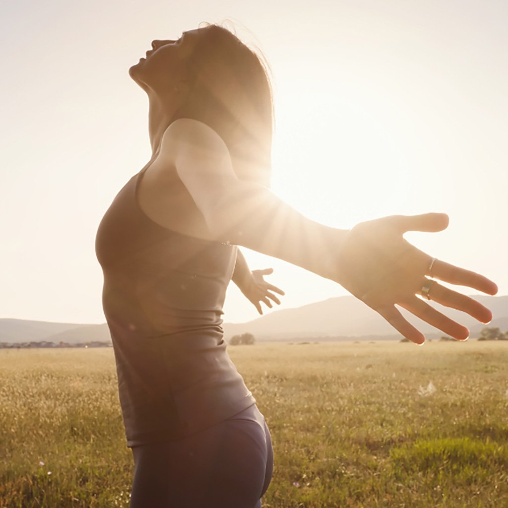 women in sunlight showing calm, clarity, and confidence