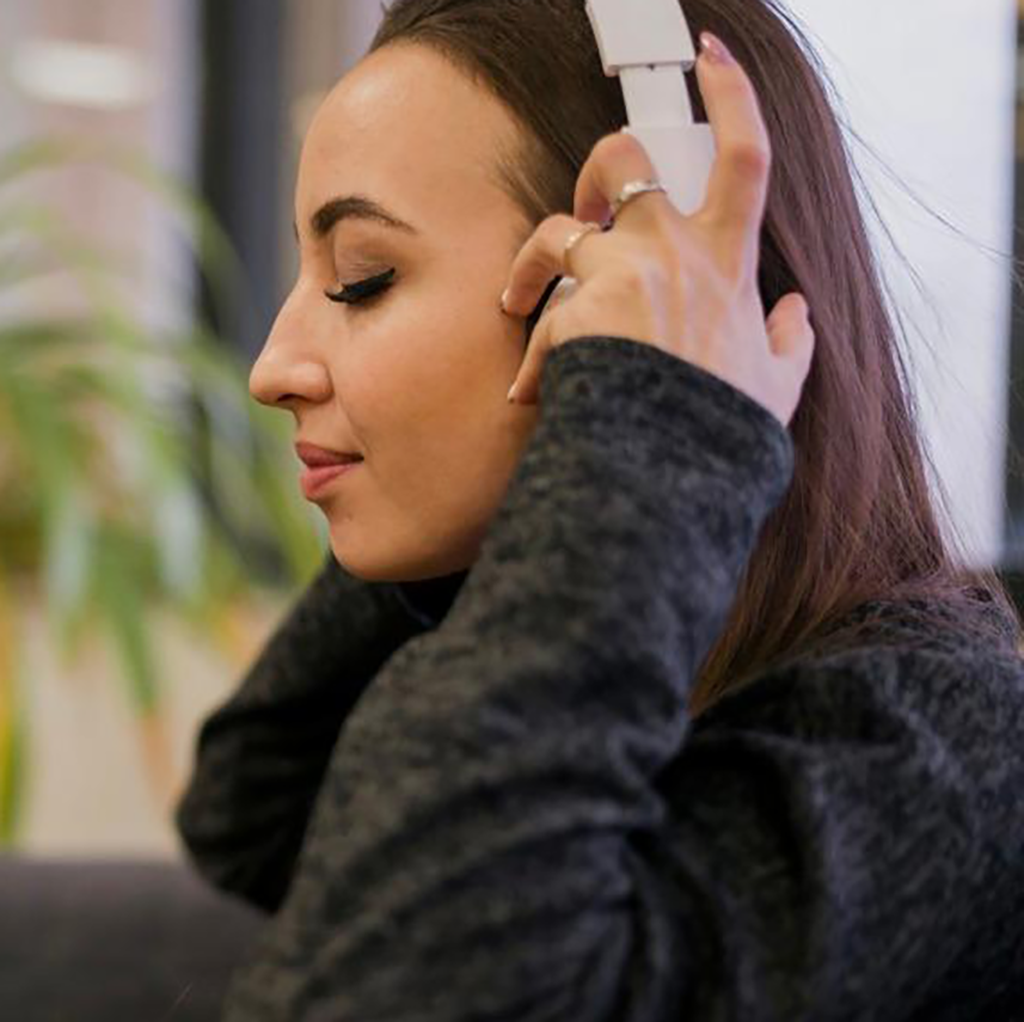 lady with headphones smiling