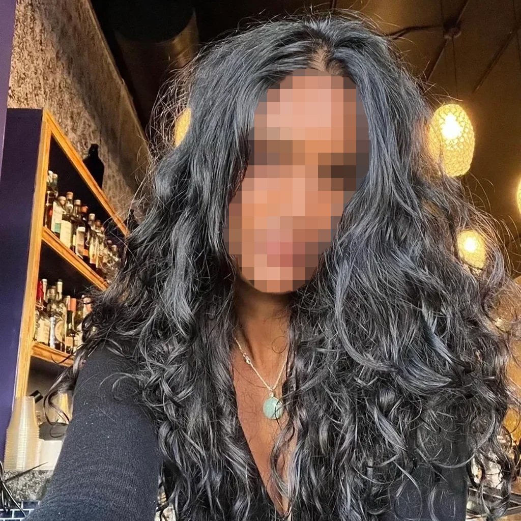 Person with long, curly black hair.