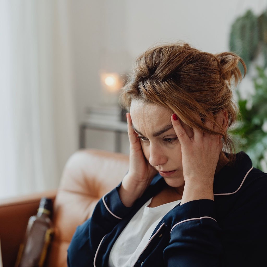 Sad Lady with hands on face looking for calm, clarity & Confidence