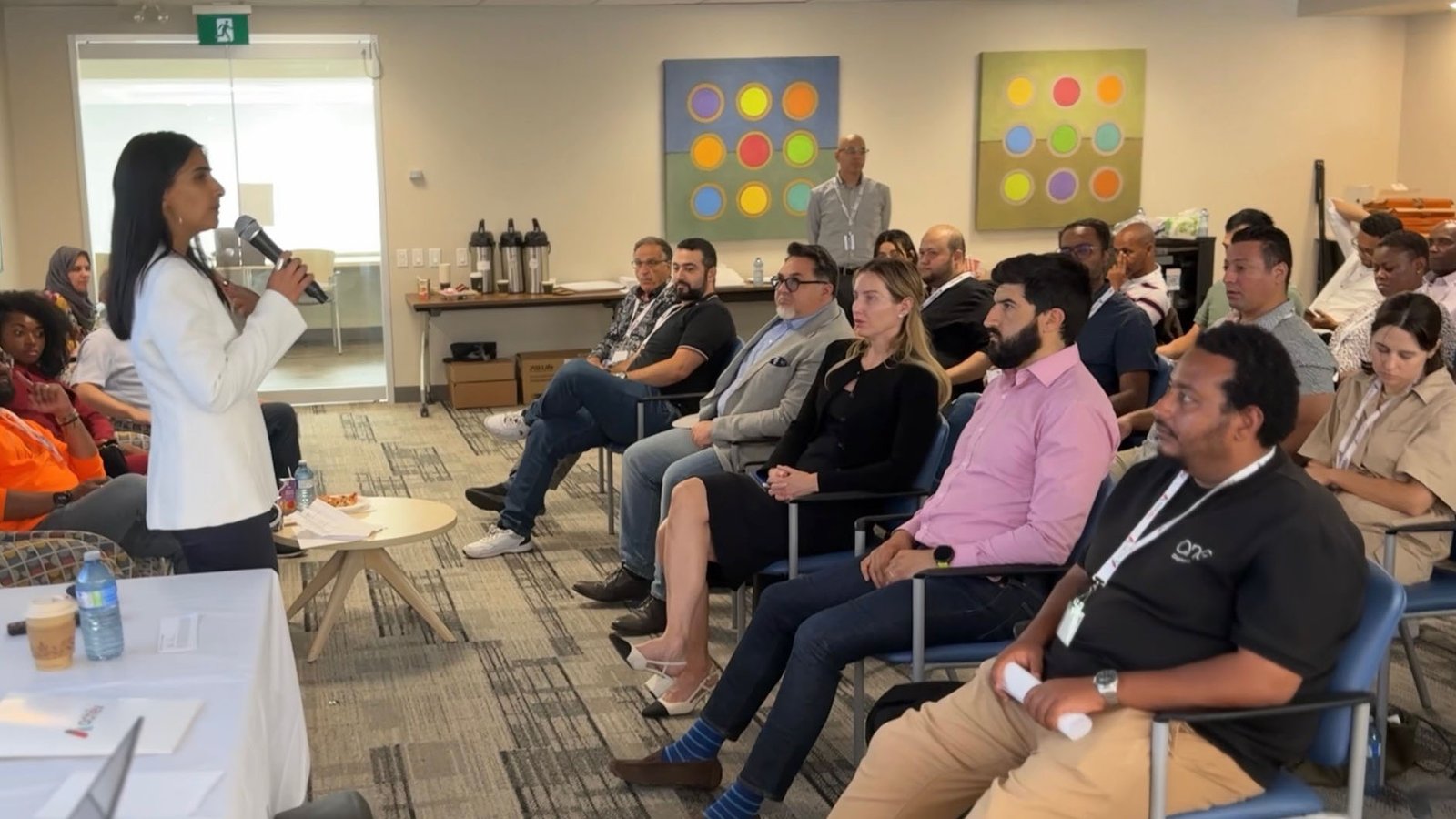 Nadia addressing engaged audience in workshop